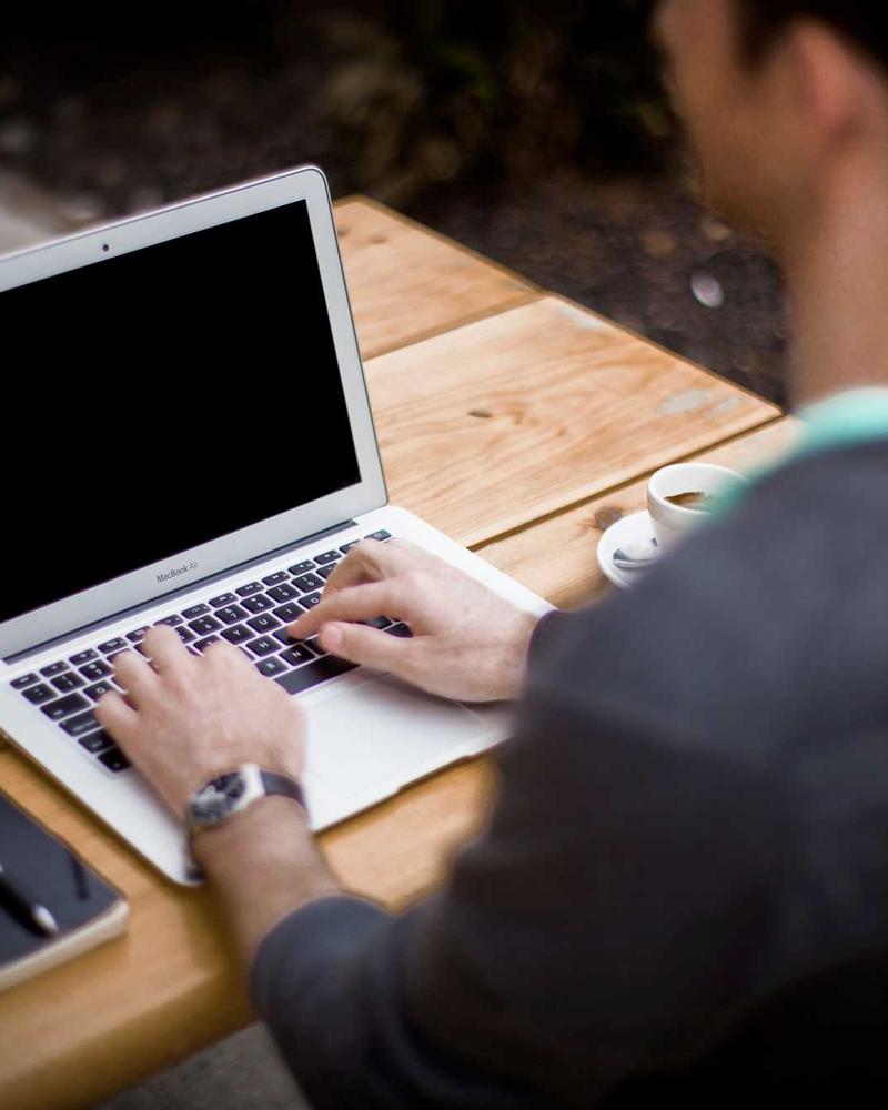 A designer at work on a laptop